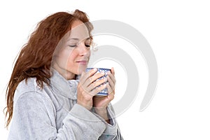 Smiling woman holding porcelain mug