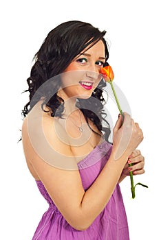 Smiling woman holding tulip with ladybird