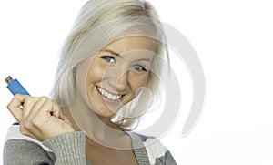 Smiling woman with holding a usb pen photo