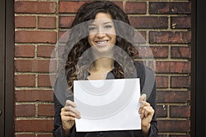 Smiling Woman Holds Blank Paper