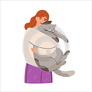 Smiling woman hugging big cute cat. Happy female pet owner with feline animals