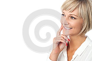 Smiling woman imagining something