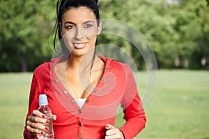 Smiling woman jogging in nature