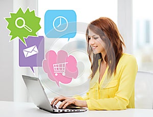 Smiling woman with laptop computer at home