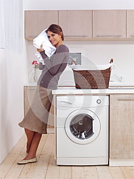 Smiling woman in the laundry room