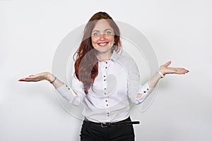 Smiling woman in a light blouse divorced aside hands isolated over a white background