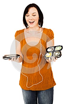 Smiling woman listening media player