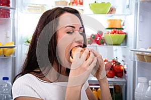 Smiling Woman Looking At Burger