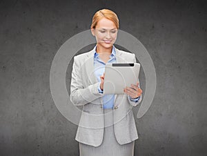 Smiling woman looking at tablet pc computer