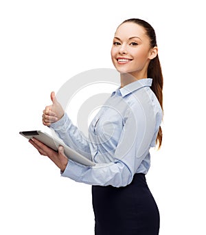 Smiling woman looking at tablet pc computer