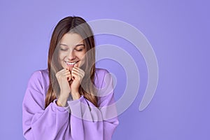 Smiling woman making wish with closed eyes