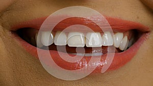 Smiling woman mouth with great white teeth close up.