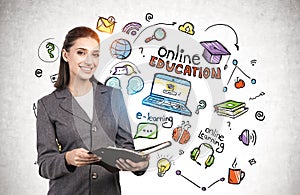 Smiling woman with notebook, online education