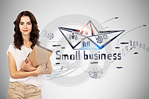 Smiling woman with notebook, small business