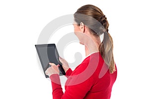 Smiling woman operating touch pad device