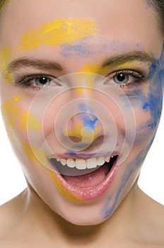 Smiling woman with paint on his face