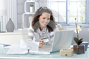 Smiling woman paying online