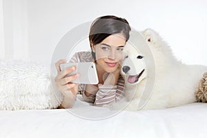 Smiling woman with pet dog. selfie