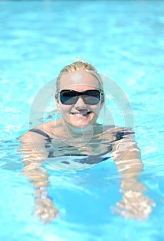 Smiling woman in pool