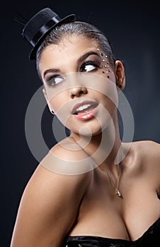 Smiling woman posing in party makeup