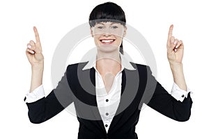 Smiling woman posing with raised fingers