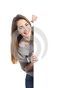 Smiling woman presenting and holding a blank sign