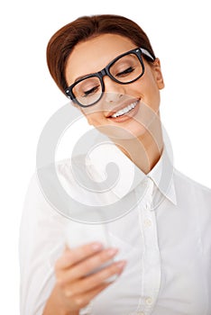 Smiling woman reading a text message