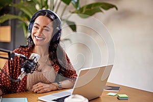 Smiling woman recording podcast