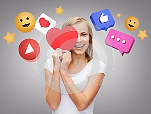 smiling woman with red heart and internet icons