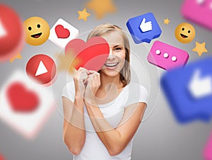 smiling woman with red heart and internet icons