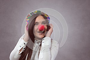 Smiling woman with red nose