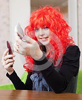 Smiling woman in red periwig