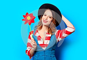 Smiling woman with red pinwheel