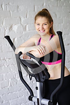 Smiling woman relaxing after cardio training