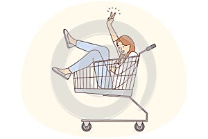 Smiling woman riding in supermarket cart