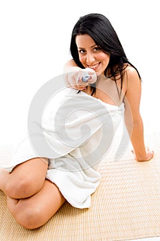 Smiling woman scrubbing her body photo