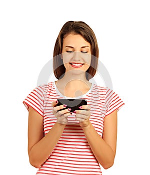 Smiling woman sending a sms on cell phone. emotional girl isolated on white background