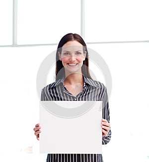 Smiling woman showing a big business card