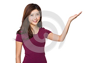Smiling woman showing copy space for product