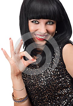 Smiling woman showing okay gesture