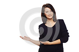 Smiling woman showing open hand palm