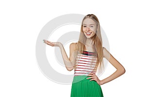 Smiling woman showing open hand palm with copy space for product