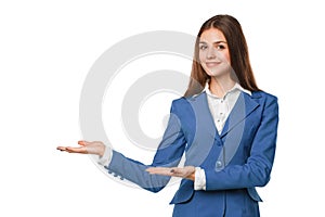 Smiling woman showing open hand palm with copy space for product or text. Business woman in blue suit, isolated over white backgro