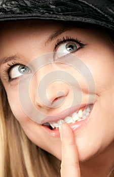 Smiling woman showing shush
