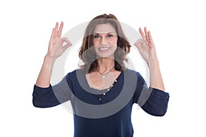 Smiling woman showing sign excellent with fingers.