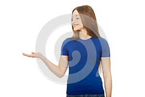 Smiling woman showing something on palm.