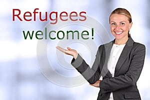 Smiling woman showing to sign welcome refugees
