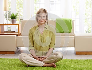 Woman on living room floor photo