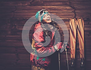 Smiling woman with skis