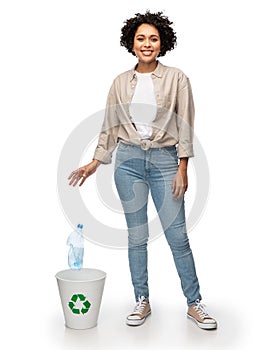 smiling woman sorting plastic waste